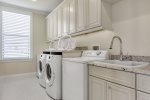The laundry room has double washers and dryers to fit your large group